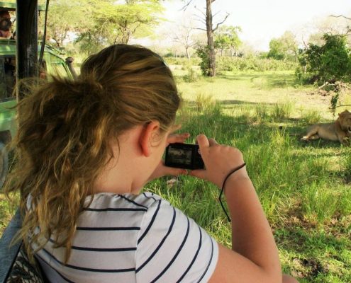 Like this young girl you will have the chance to photograph different animals during your 4 Days Budget Safari in Tanzania