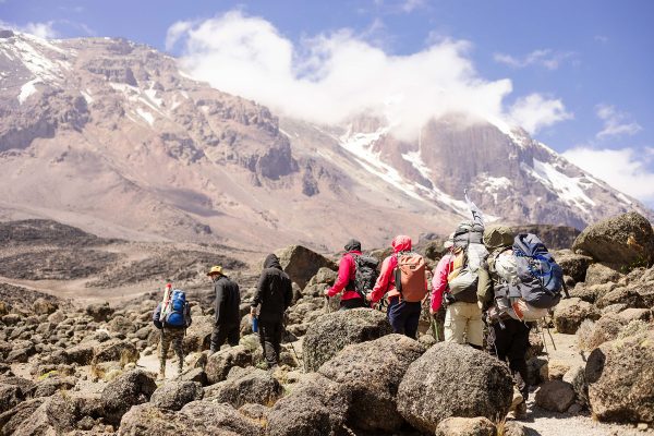 Hikers climbing mountain Kilimanjaro along the machame route